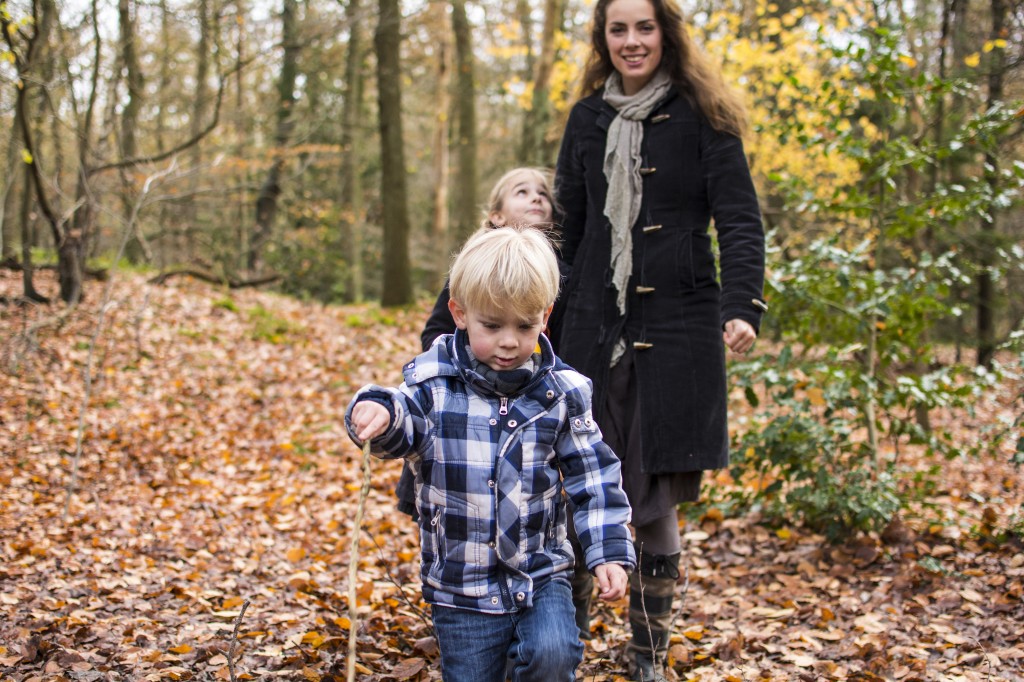 Little kids in forrest hiking