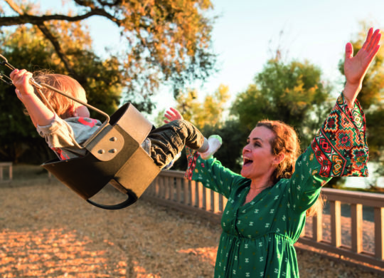 Male Caucasian Toddler Having fun at the playground with his mom