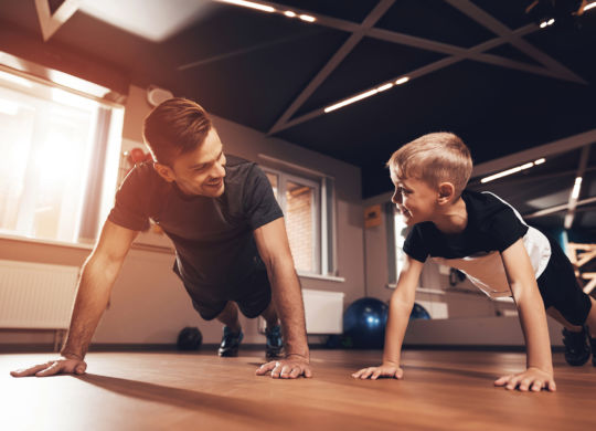 3060247 Father and son in the gym. Father and son spend time tog